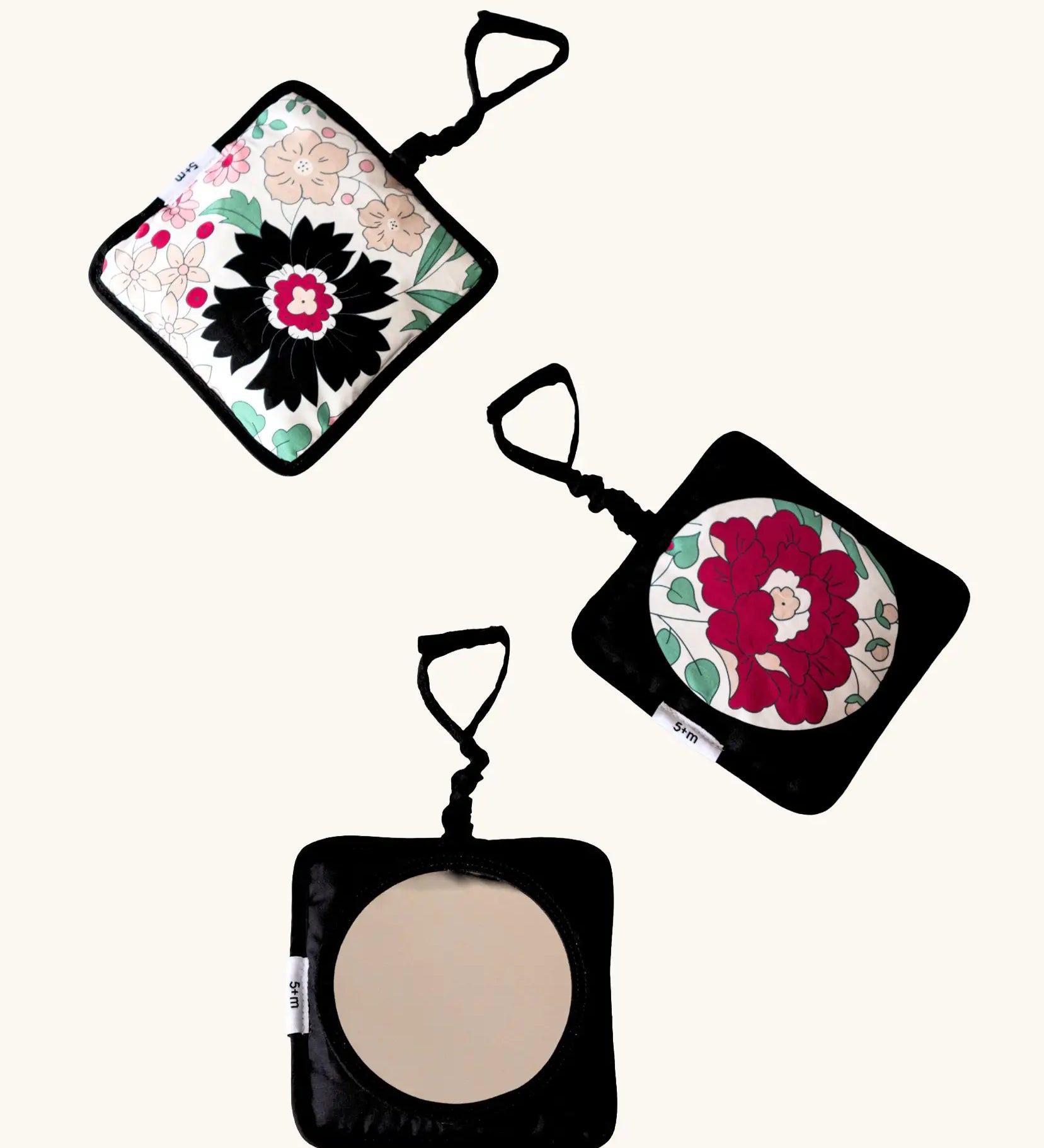 Set of 3 Etta Loves x Liberty hanging squares showing 2 pastel floral designs and a sensory mirror 