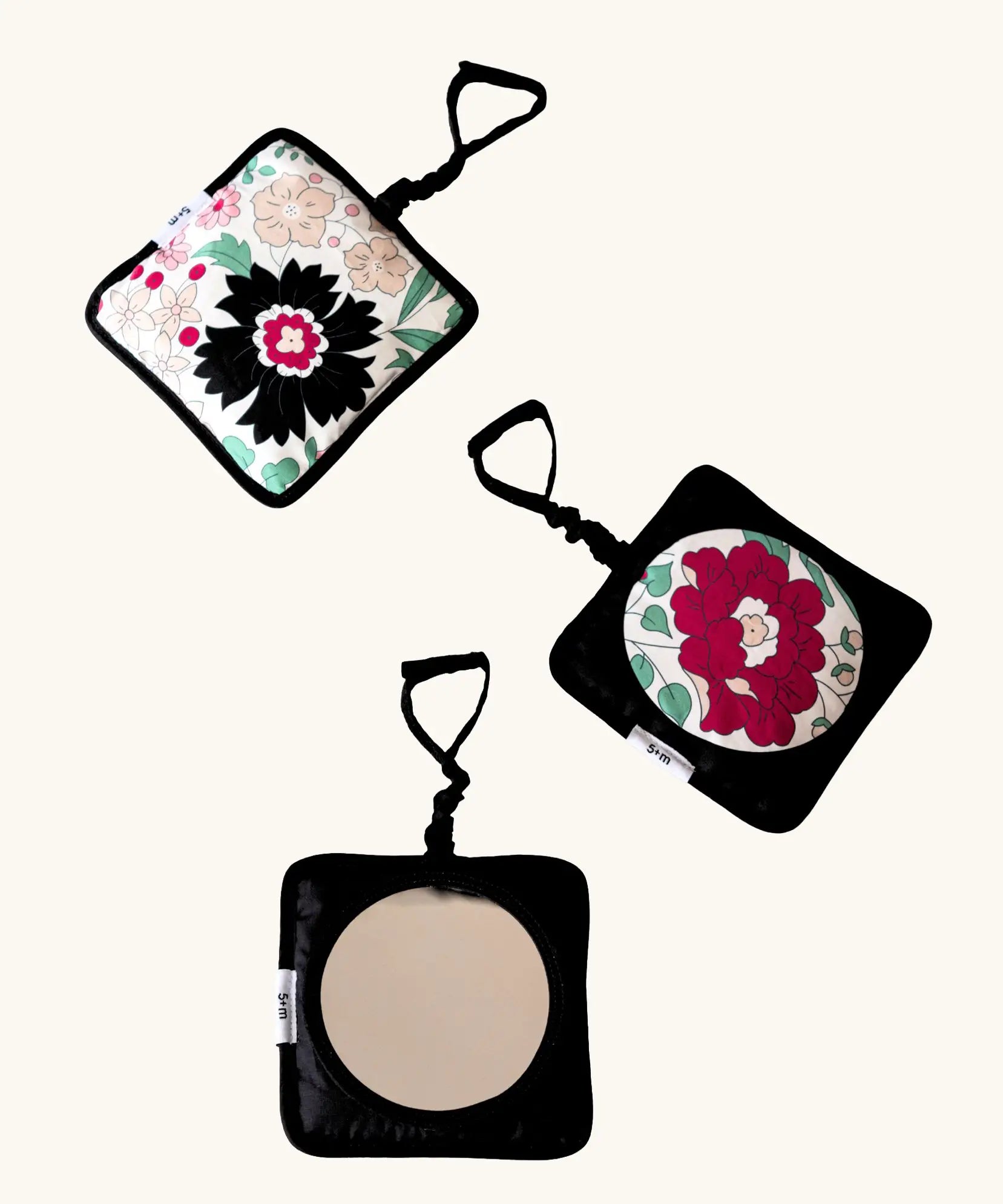 Set of 3 Etta Loves x Liberty hanging squares showing 2 pastel floral designs and a sensory mirror 