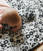 GOTS organic cotton reversible sensory playmat from Etta Loves in collaboration with Liberty showing Fairford shadow design with baby crawling on top

