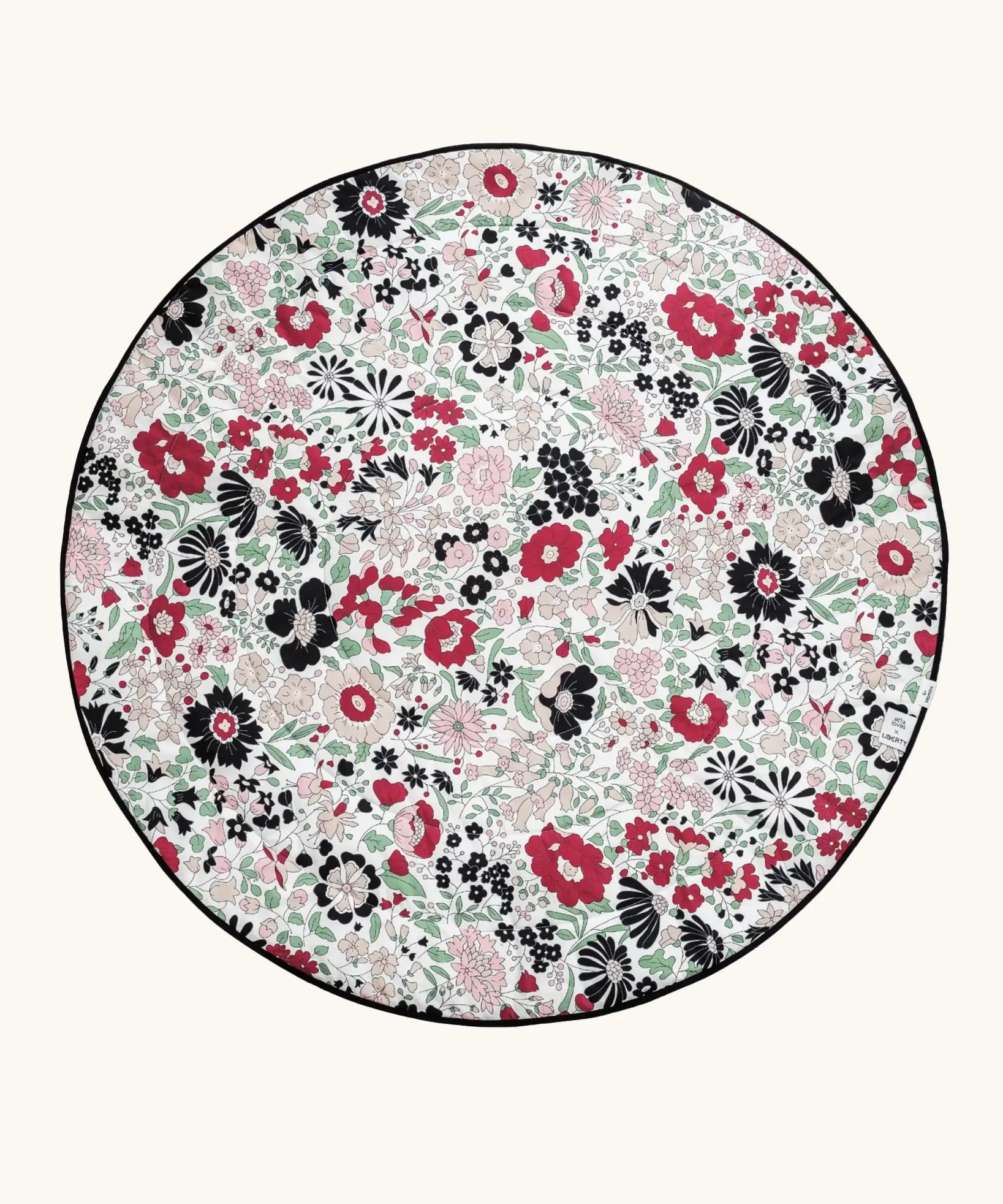 GOTS organic cotton reversible sensory playmat from Etta Loves in collaboration with Liberty showing the Wharfedale Meadow on the other for 5 months onwards.

