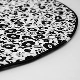 GOTS organic cotton reversible sensory playmat from Etta Loves in collaboration with Liberty laid flat showing the Fairford shadow design with black rim