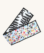 Etta Loves Organic Cotton Reversible Sensory Strip - Plant Print, with a colourful Sycamore print on one side, and a striking and bold black fern print on the other