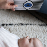 A close up of a parent playing with their child, using the Etta Loves Sensory Positive Affirmation Flash Cards