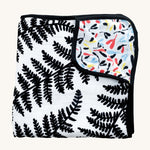 Etta Loves Reversible Organic Cotton Muslin Blanket - Plant Print with black and white Ferns on one side, and colourful Sycamore seeds print on the other