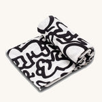 The Etta Loves X Keith Haring Extra Large Organic Cotton Baby Muslin Square - Baby, with a high-contrast black and white design crawling baby design 