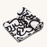The Etta Loves X Keith Haring Extra Large Organic Cotton Baby Muslin Square - Baby, with a high-contrast black and white design crawling baby design 