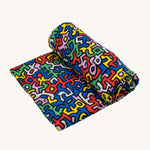 Etta Loves X Keith Haring Extra Large Organic Cotton Baby Muslin Square - Brazil, with strong, colourful shaped print 