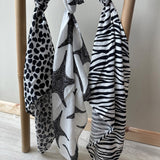 A closer look at the print and pattern of the Etta Loves Extra Large Organic Cotton Baby Muslin Square - Purple Leopard.