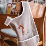 Fabelab kids organic cotton cross back bib with an embroidered candy cane