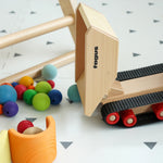 Fagus Wooden Caterpillar Dumper Truck. The image shows the adjustable tipper at the back in an upright position