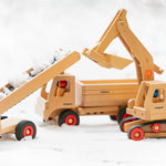 Fagus handmade wooden vehicle toys in a snow scene