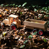 Fagus wooden trailer hitched onto a tractor, with the trailer filled with conkers.
