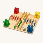 Fagus Handmade Wooden The Path Is The Game. The images shows the wooden peg counters, dice and colourful pegs on the board