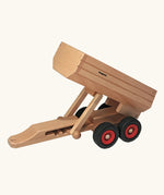 Fagus wooden trailer toy with the trailer bed tipped up.
