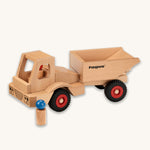 Fagus Wooden Wheels Dumper Truck, with two wooden peg doll figures. One is inside the dumper truck, and one is standing next to the dumper truck