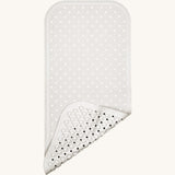 A close up of the Fair Zone natural rubber pearly white bath mat available at Babipur, showing the suckers on the underside for holding the mat down.  