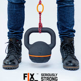 Close up of man using a FixIts mouldable plastic strip to pull up a 16kg weight