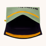 An open Fluf Flip Organic Cotton Snack Bag in a moss green colour. A reusable cotton bag with the word 'snack written in black front on the front.