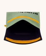 An open Fluf Flip Organic Cotton Snack Bag in a moss green colour. A reusable cotton bag with the word 'snack written in black front on the front.