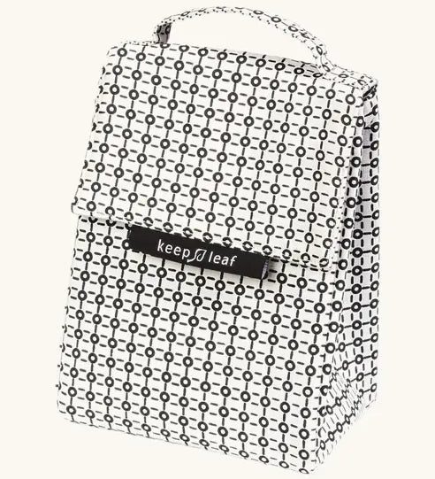 A black and white geometric patterned Fluf lunch bag with a top handle and a black brand label reading 'keep leaf' on the front, shown against a plain off-white background.