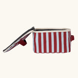 Side view of the Fluf GOTS organic cotton square lunch bag in a awning stripe chilli pepper design with a white zip detail. Features a matching colour carry handle on the top and side.