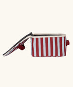 Side view of the Fluf GOTS organic cotton square lunch bag in a awning stripe chilli pepper design with a white zip detail. Features a matching colour carry handle on the top and side.