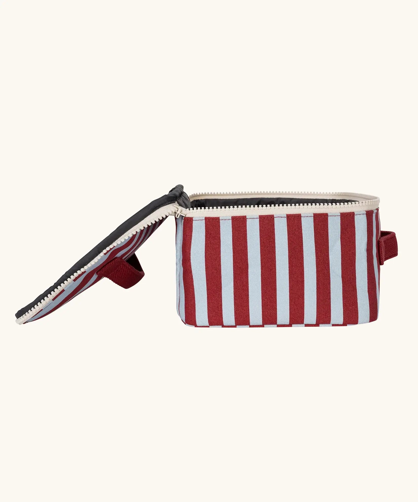 Side view of the Fluf GOTS organic cotton square lunch bag in a awning stripe chilli pepper design with a white zip detail. Features a matching colour carry handle on the top and side.