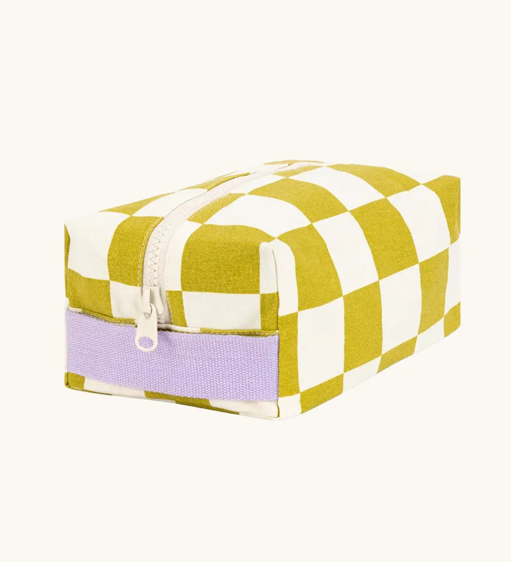 Fluf Traveller Bag in checks pear, a compact organic cotton washbag with lilac carry handle and zip.