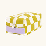 Fluf Traveller Bag in checks pear, a compact organic cotton washbag with lilac carry handle and zip.