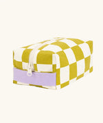 Fluf Traveller Bag in checks pear, a compact organic cotton washbag with lilac carry handle and zip.