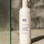 The Yes Cleanse Intimate Wash Fragrance Free -150ml on a shower floor