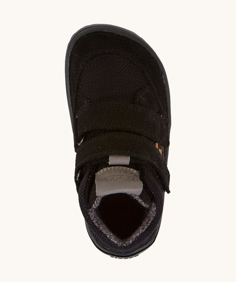 A view from above of the Froddo Barefoot TEX Kids Autumn Shoes in Black showing the wide toe box at the front. A soft ankle high shoe in black with a barefoot black rubber sole. Features two velcro straps for a secure fit.  We have a range of children's barefoot shoes available at Babipur. 