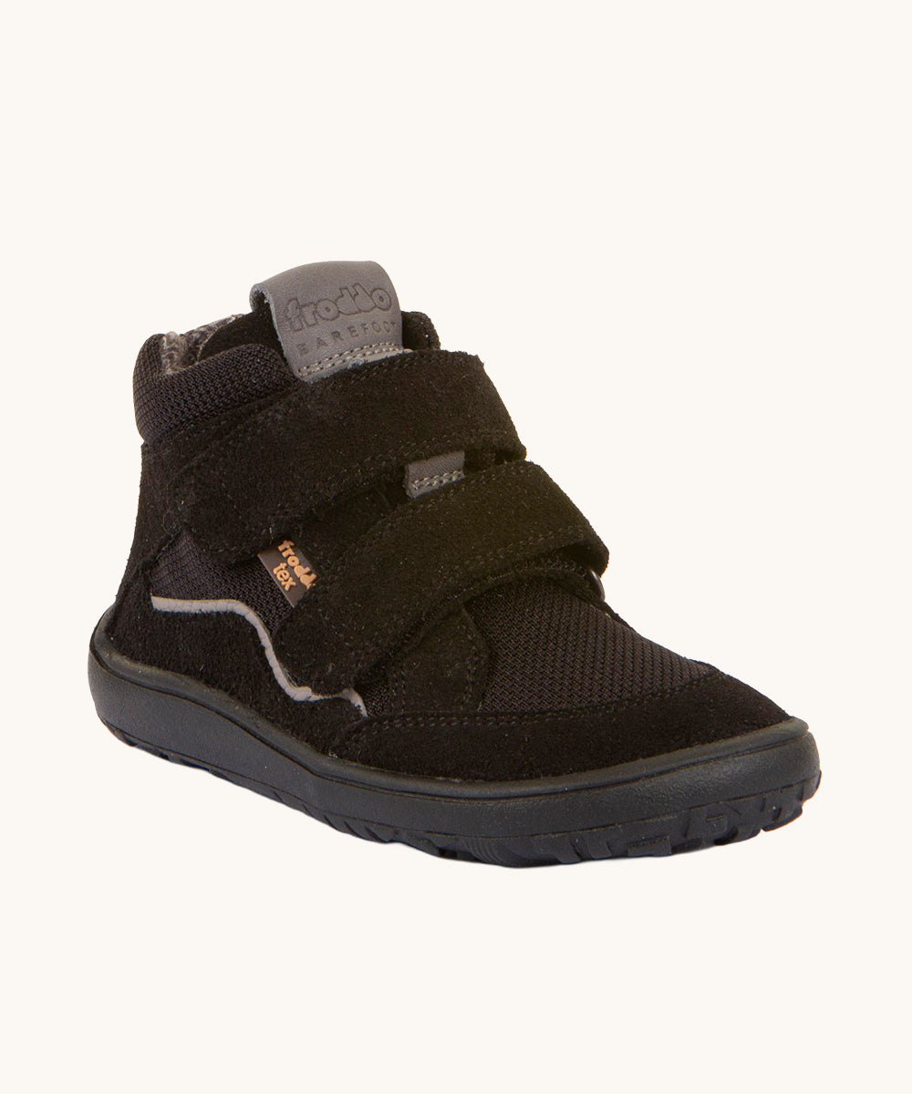 Froddo Barefoot TEX Kids Autumn Shoes in Black. A soft ankle high shoe in black with a barefoot black rubber sole. Features two velcro straps for a secure fit.  We have a range of children's barefoot shoes available at Babipur. 