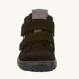 The front of the Froddo Barefoot TEX Kids Autumn Shoes in Black. A soft ankle high shoe in black with a barefoot black rubber sole. Features two velcro straps for a secure fit.  We have a range of children's barefoot shoes available at Babipur. 