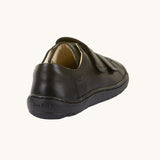 A view of the back of the Froddo Barefoot Black Alex Kids Leather School Shoes. A black leather child's school shoe with two velcro strap fastenings with a barefoot sole. We have a range of children's barefoot shoes available at Babipur. 