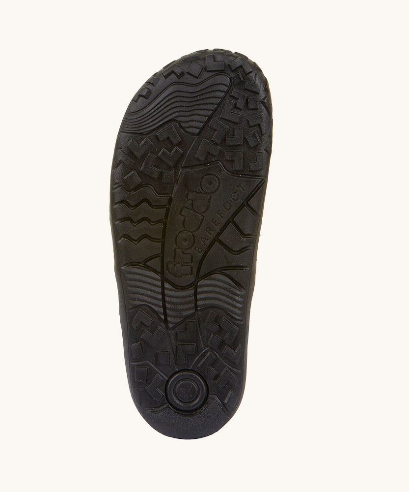 The soles of the Froddo Barefoot Black Alex Kids Leather School Shoes. A black leather child's school shoe with two velcro strap fastenings with a barefoot sole. We have a range of children's barefoot shoes available at Babipur. 