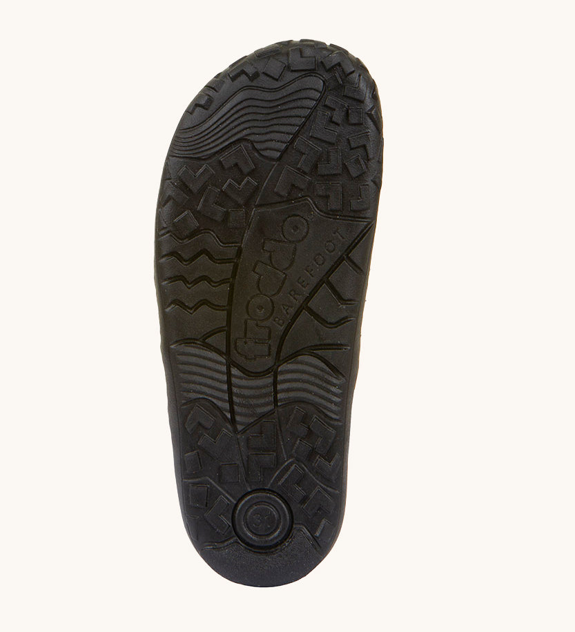 The soles of the Froddo Barefoot Black Alex Kids Leather School Shoes. A black leather child's school shoe with two velcro strap fastenings with a barefoot sole. We have a range of children's barefoot shoes available at Babipur. 