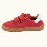 Side view of the Froddo barefoot f-motion kids shoes in red with white stripe design on the side has 2 velcro fasteners and a flexible rubber sole.