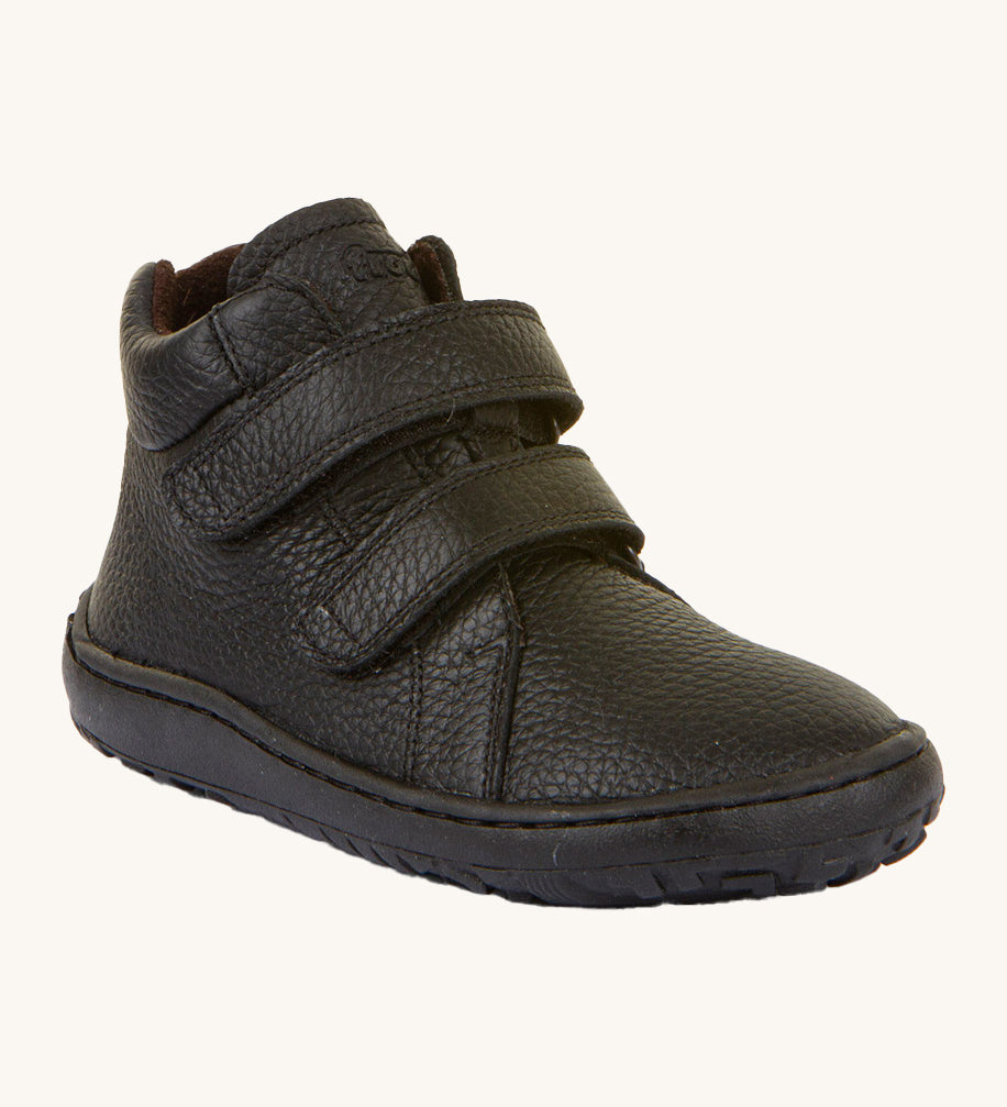 Froddo barefoot Autumn children's shoe in black. A natural leather shoe with a 2 velcro fastener on the front for a secure fit, padded ankle and a matching black grippy sole.