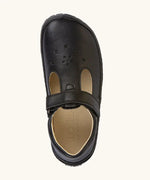 Top view of Froddo natural leather barefoot children's shoe in black showing velcro strap fastener and cut out decoration