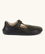 Side of Froddo's natural leather barefoot children's shoe in black showing t-bar velcro fastener and rubber sole