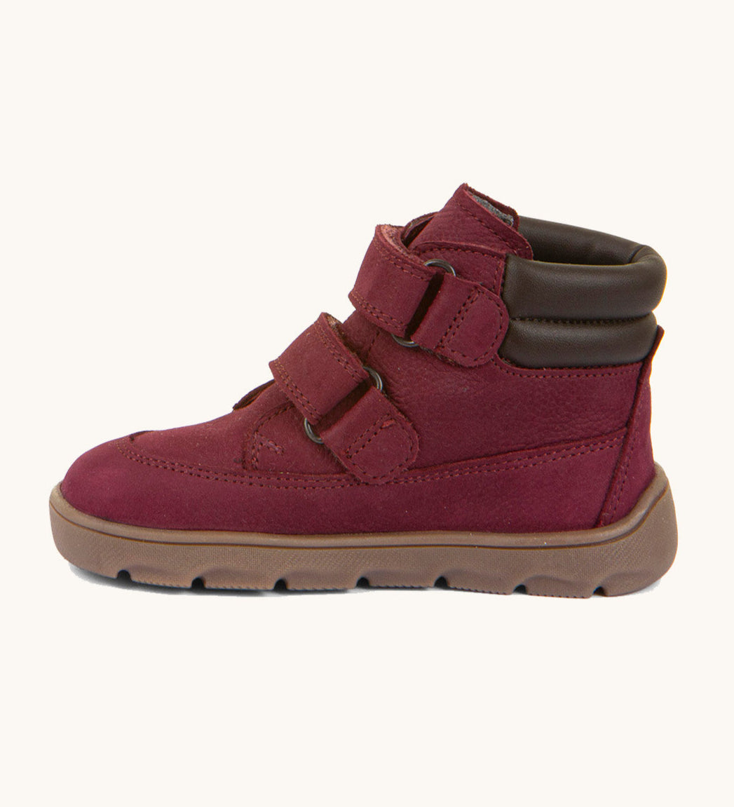 A side image of the Froddo barefoot Zuru tex children's shoe in Bordeau showing the 2 velcro fastener, padded ankle and the dark brown grippy sole