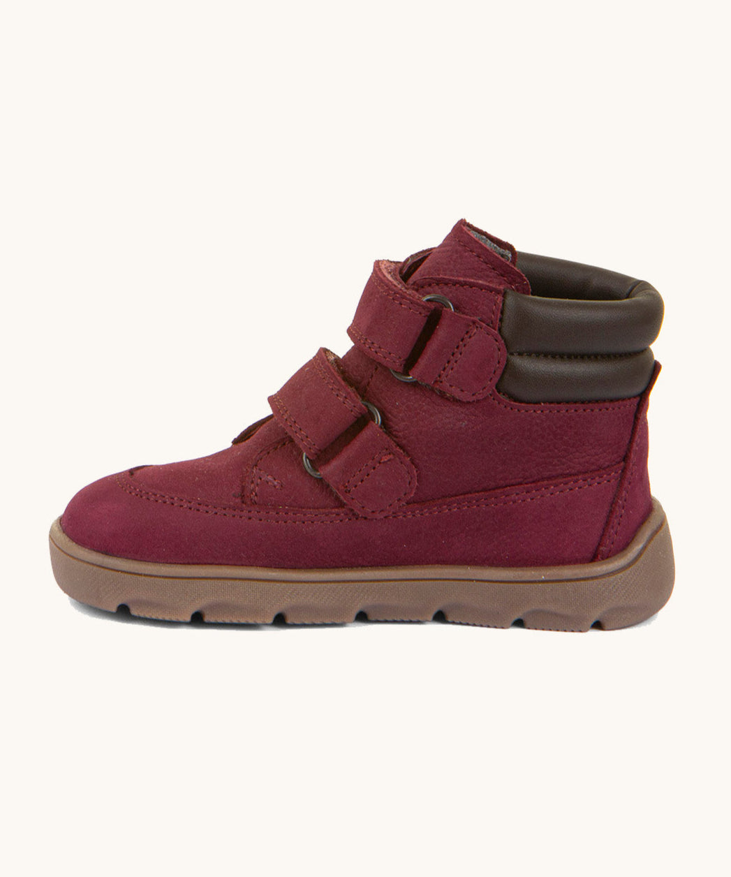 A side image of the Froddo barefoot Zuru tex children's shoe in Bordeau showing the 2 velcro fastener, padded ankle and the dark brown grippy sole