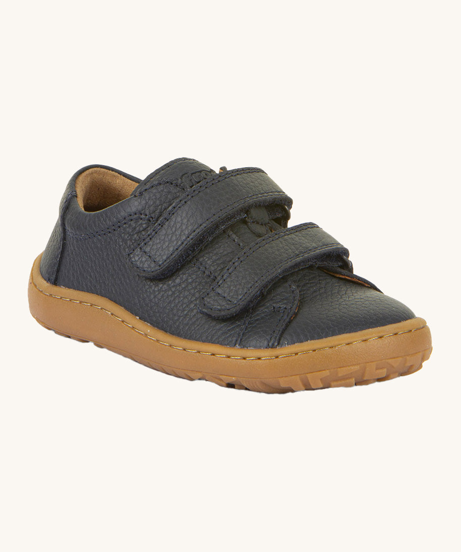 Froddo barefoot base children's shoe in dark blue. A natural leather low profile shoe with a 2 velcro fastener for a secure fit and a grippy sole