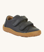 Froddo barefoot base children's shoe in dark blue. A natural leather low profile shoe with a 2 velcro fastener for a secure fit and a grippy sole