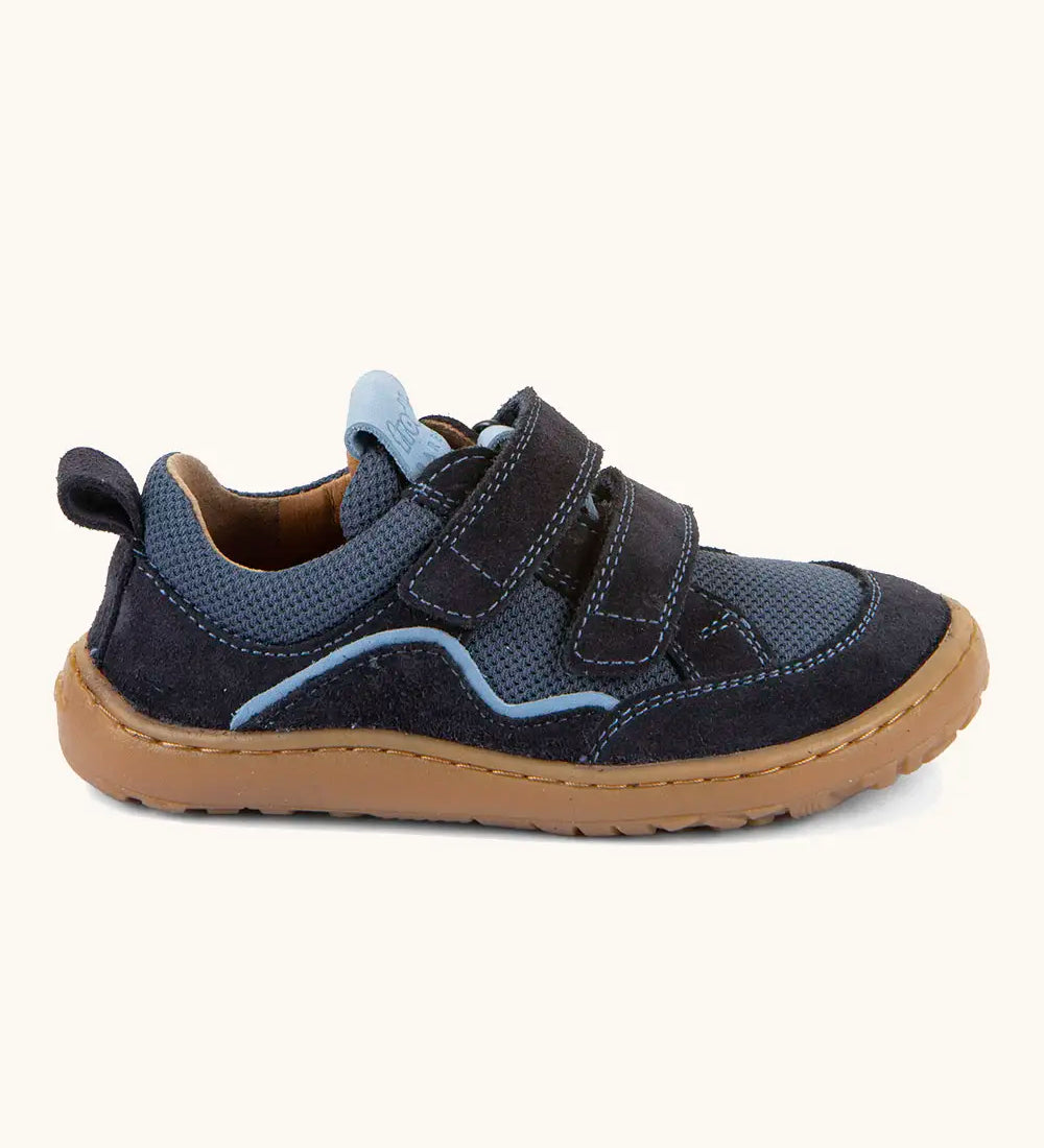 Froddo barefoot base children's shoe in dark blue with a contrast stripe. A trainer showing 2 velcro fasteners and rubber sole