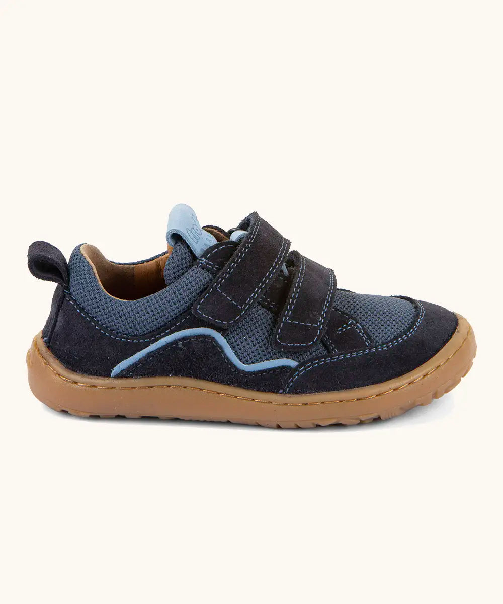 Froddo barefoot base children's shoe in dark blue with a contrast stripe. A trainer showing 2 velcro fasteners and rubber sole