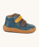 A side image of the Froddo barefoot first step baby shoe in dark denim available at Babipur showing the 2 velcro fastener and padded ankle support detail