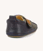 The back of the Froddo barefoot walker baby shoe in dark blue available at Babipur showing padded ankle support and pull tab detail