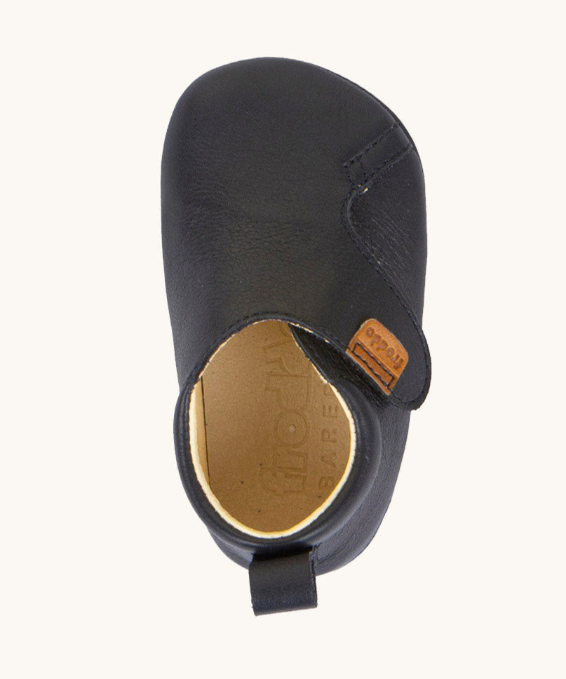A top down image of the Froddo barefoot walker baby shoe in dark blue available at Babipur showing the velcro strap fastener and inner sole detail